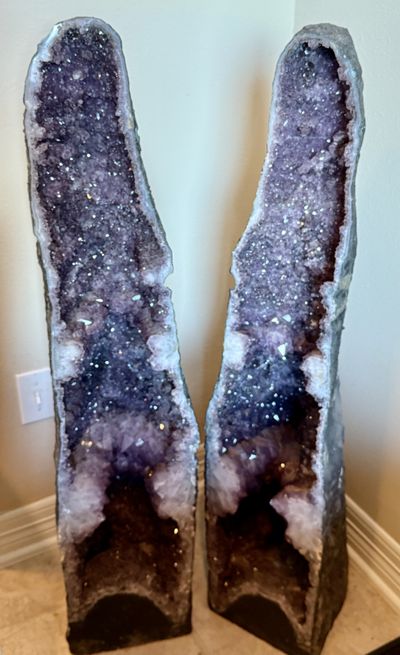 A matched pair of tall amethyst cathedral geodes